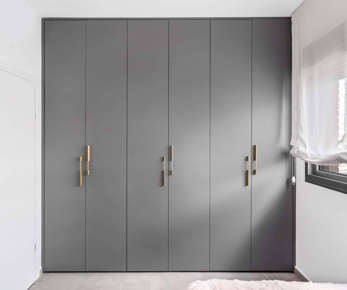 Custom closet drawer bank with dividers and integrated lighting by iKitchen Cabinetry