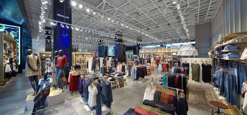 Commercial retail millwork built with durable laminate surfaces and integrated display shelving