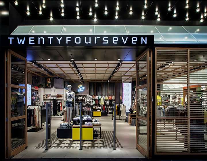 Illuminated retail storefront with custom display fixtures by iKitchen Cabinetry