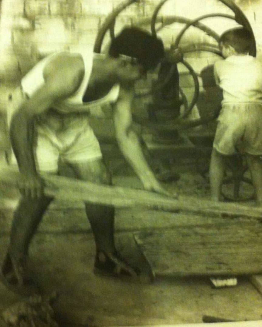 Archival workshop photograph, cabinetmakers at work on timber