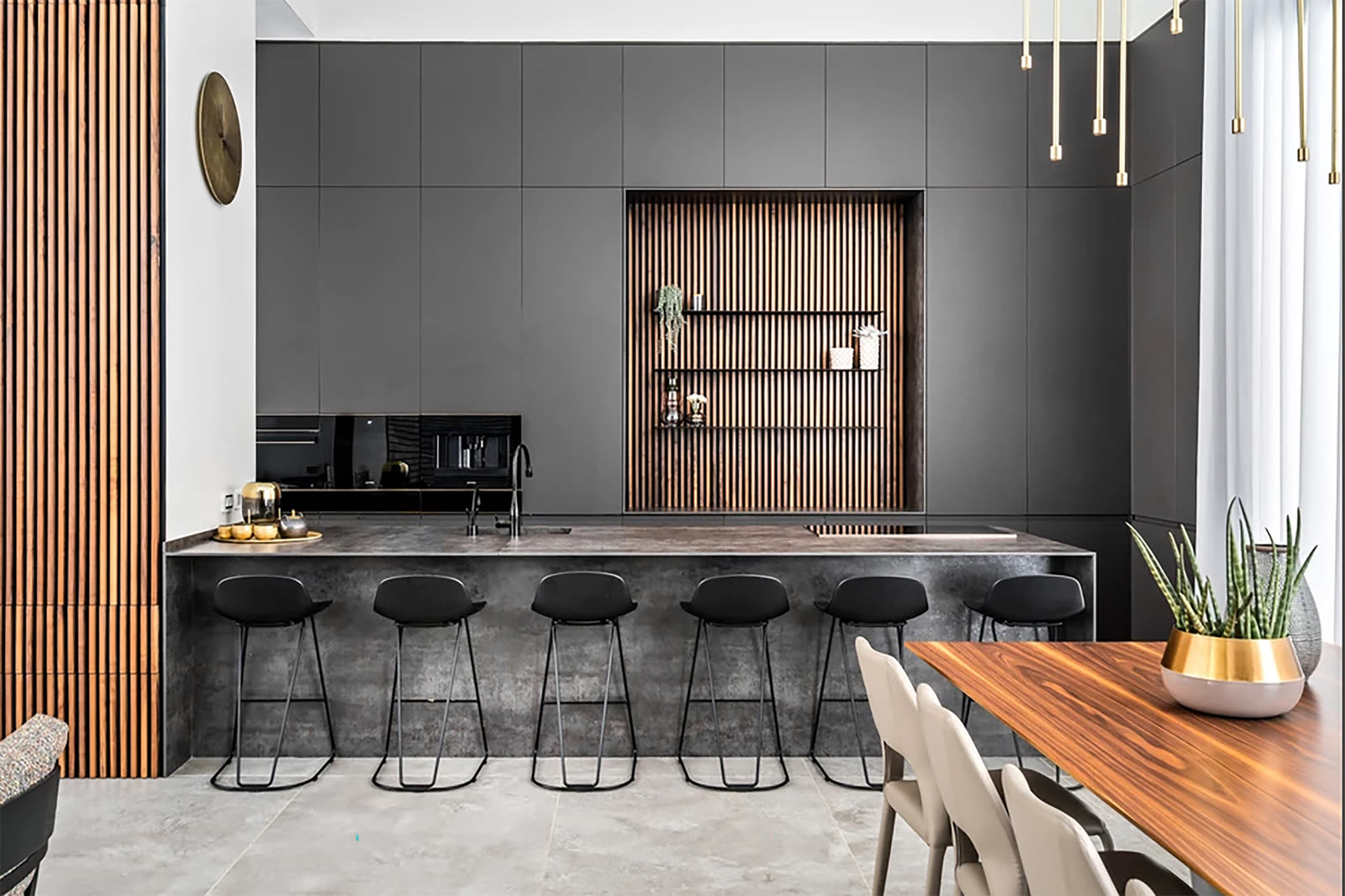 Charcoal minimal kitchen with wood-slat niche and hidden storage by iKitchen Cabinetry