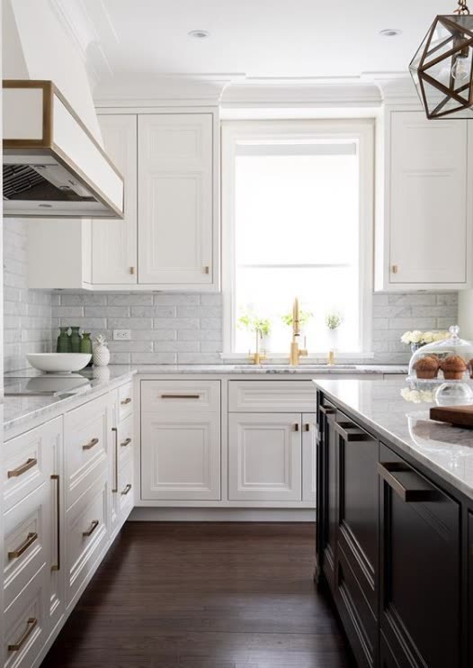 Timeless white traditional kitchen with furniture-grade detailing by iKitchen Cabinetry